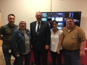 Group shot, Dale Irving, Maureen Anders, Mike Freeman, Dana Healy, Pat Cook, in front of TV